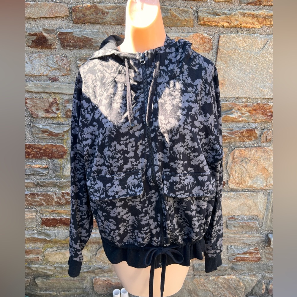 Zella zip-up sweatshirt with hood. Ties at the waist.
